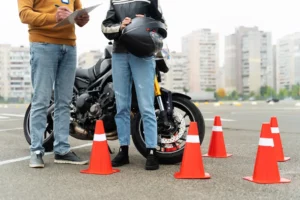 Teacher giving tips to newbie motorcycle rider