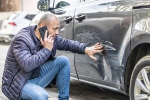 A man calling the police to report an accident